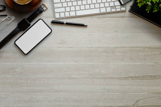 istock Top view office supplies with laptop, cup of coffee,leather notebook with workspace. 908249286