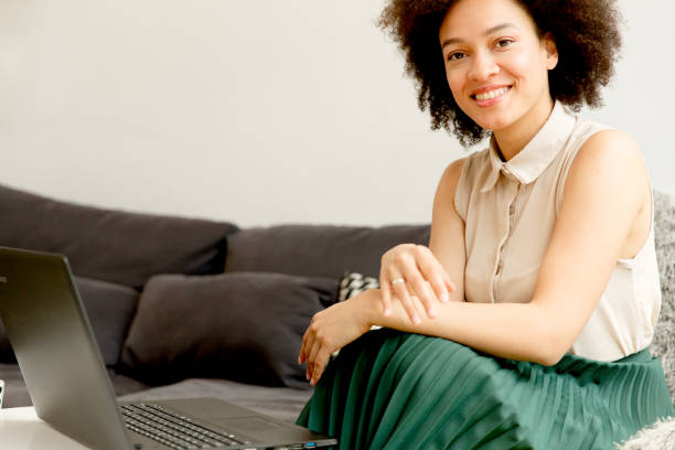 istock Young african american woman web-surfing internet 908252022