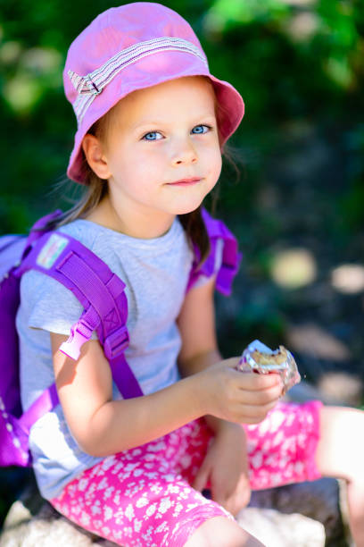 girl eating chocolate wafers - chocolate bar
