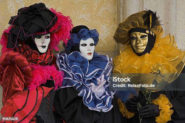 Three Masks With Beautiful Costumes At Carnival In Venice Stock Photo - Download Image Now