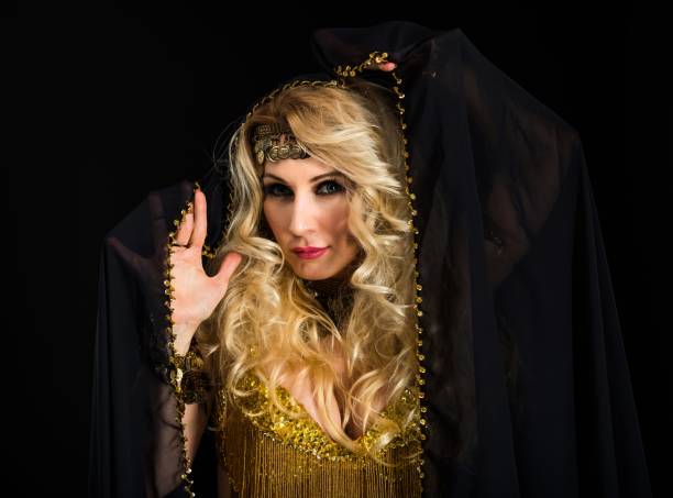 istock Woman fortune teller portrait at black 908258634