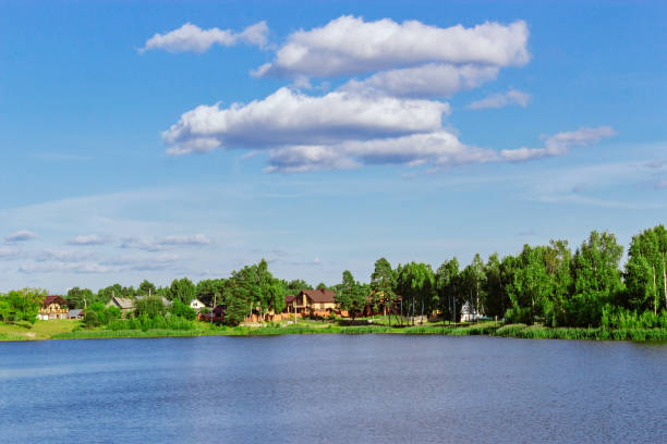 istock rural houses on the lake 908259224