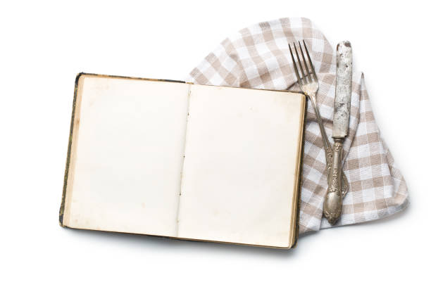 istock vintage book and cutlery on white background 908263032