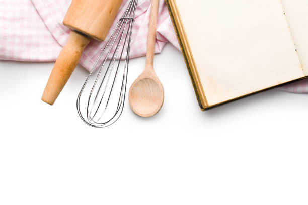 istock recipe book and kitchen utensils on white background 908263138