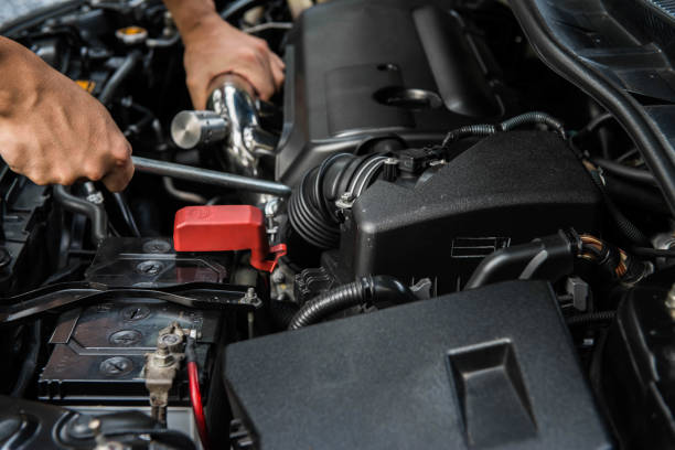istock Hand of mechanic is repairing car engine 908275098