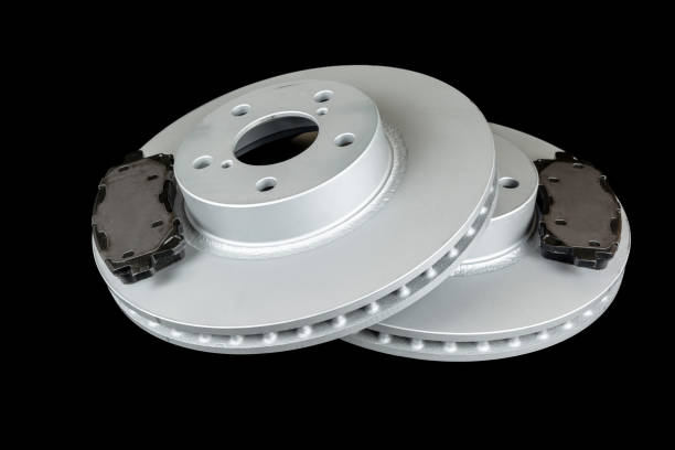 istock Brake discs and pads on a black background 908276288