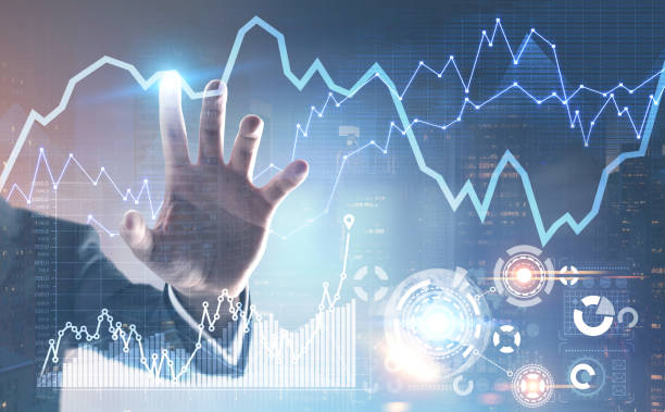 istock Businessman s hand, graphs and HUD 908278614
