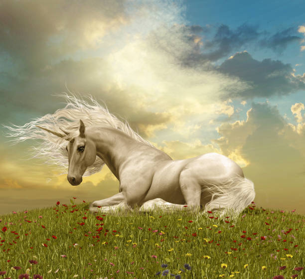 istock Enchanting White Unicorn Resting During a Sunset 908279348