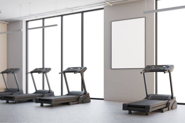 istock Four treadmills in a white room, poster side 908280788