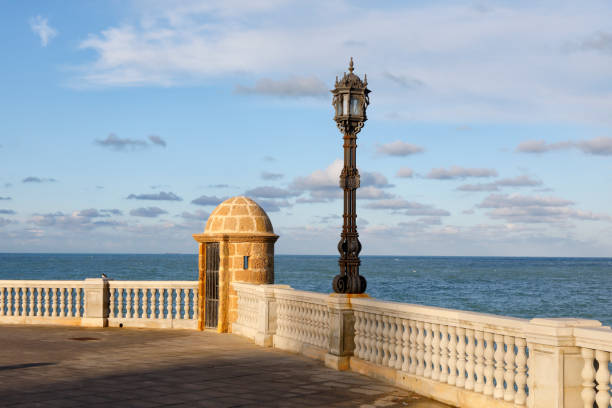 istock Lantern at the waterfront promenade,Cadiz, Andalusia, Spain 908283482