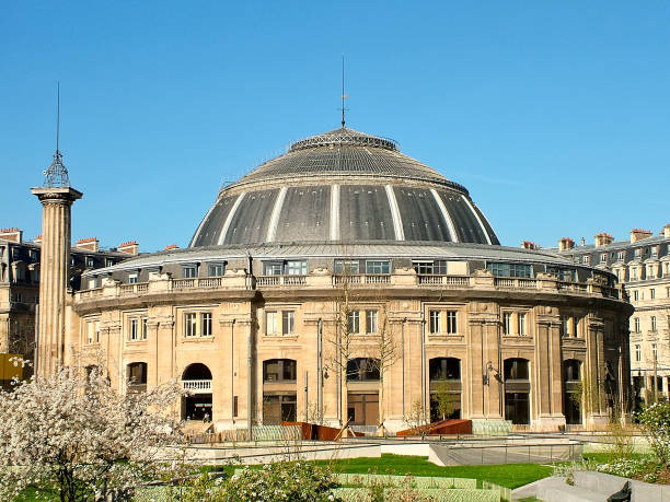 Bourse de Commerce de Paris  in the quarter Les Halles in Paris.  On the left - column of the Medici (Colonne Medicis), France