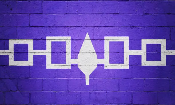 Flag of the Iroquois Confederacy painted on a brick wall.