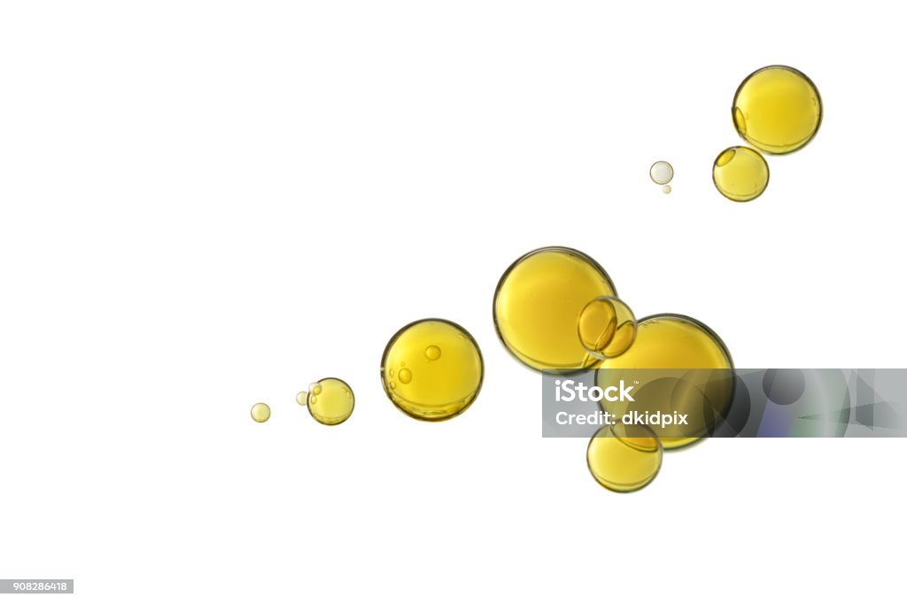 Beautiful yellow bubbles Beautiful yellow olive oil bubbles isolated over a white background. Cooking Oil Stock Photo