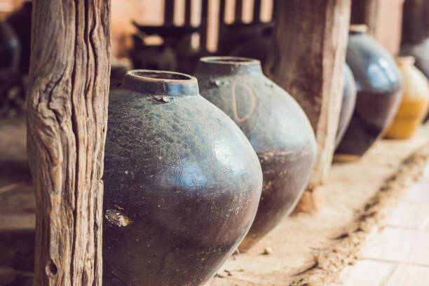 Ancient Vietnamese traditional pots overgrown with seashells Ancient Vietnamese traditional pots overgrown with seashells. bat trang stock pictures, royalty-free photos & images