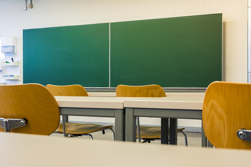 Empty Wooden Chairs at Tables Depth of Field Lecture Hall Nobody Green Chalkboard University Education College Higher Single Seat