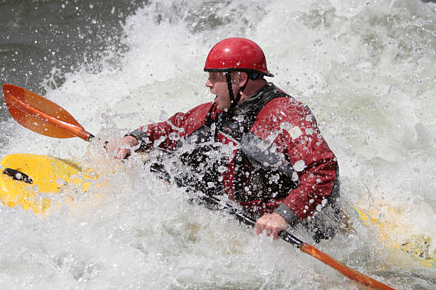istock Whitewater Kayaker Paddling Through the Waves 90829081