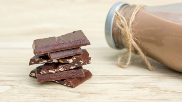 istock Chocolate milk on a wooden table. 908292932