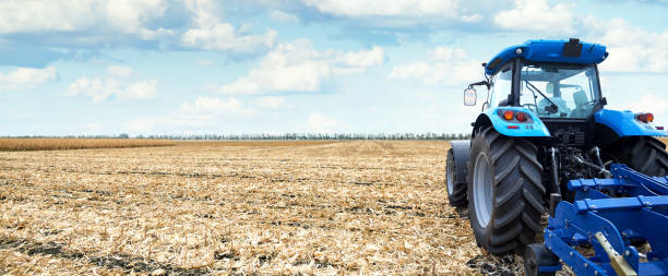 istock Modern tractor is working in the field 908294614