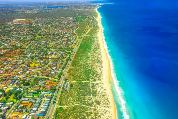 Aerial view of Scarborough Beach at coastal suburb of Perth, Western Australia, located approximately 14 km northwest of the city center. Scenic flight over the shoreline and the coral coast.