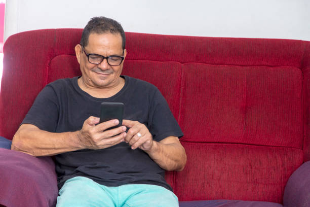 istock Poor Brazilian man relaxing at home 908300676
