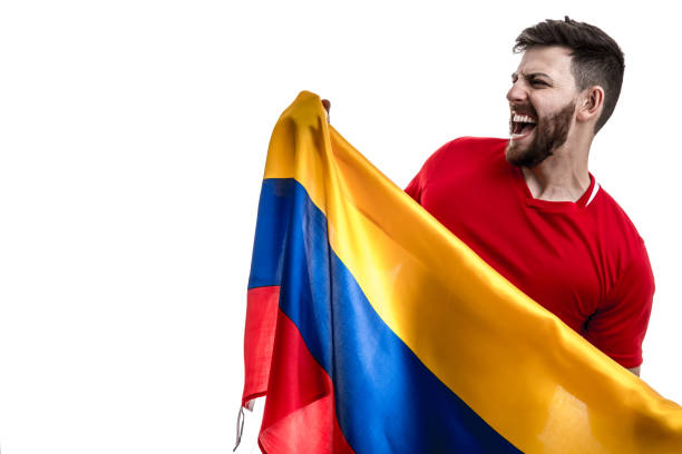 colombian male athlete / fan celebrating on white background - fan sport football male imagens e fotografias de stock