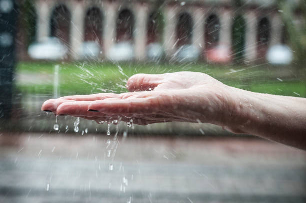 istock woman hand in the rain 908301224