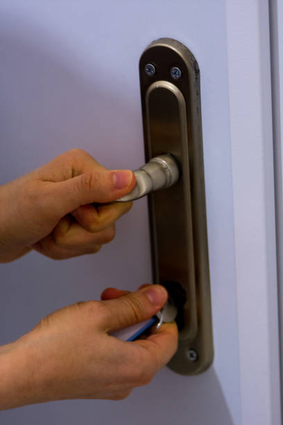 istock Woman locking the door 908301348