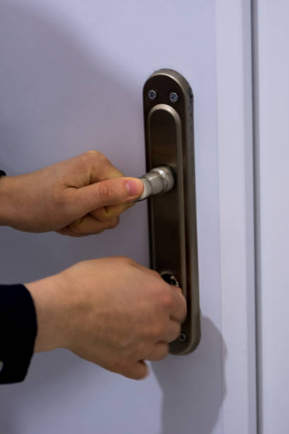 istock Woman locking the door 908301522