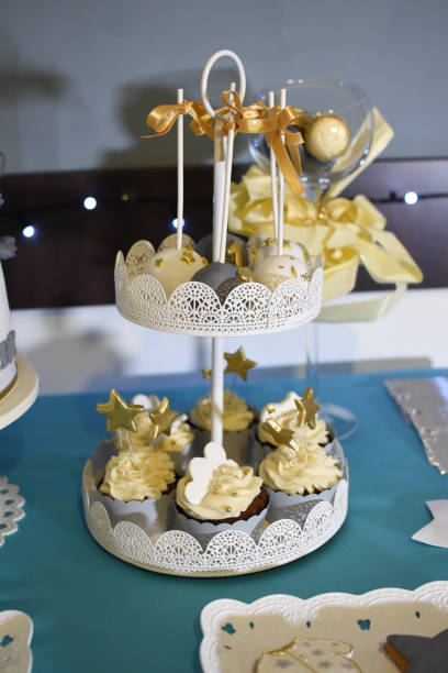 istock Sweet table and delicious cakes for first birthday 908303822