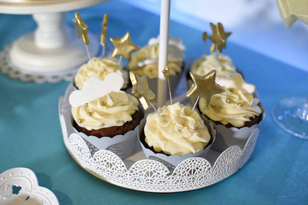 istock Sweet table and delicious cakes for first birthday 908303954