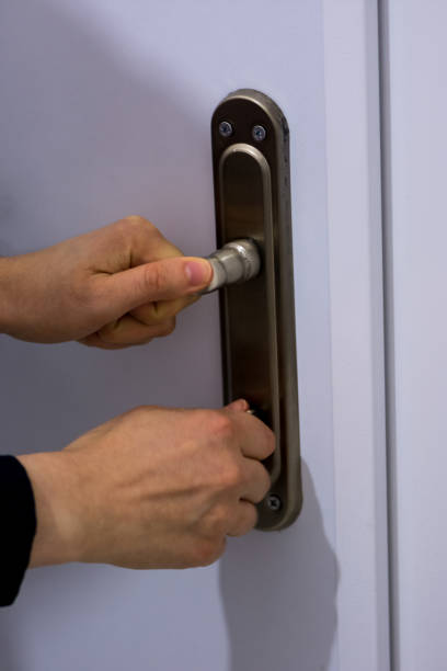 istock Woman locking the door 908304078
