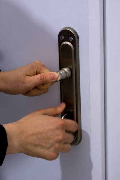 istock Woman locking the door 908304706