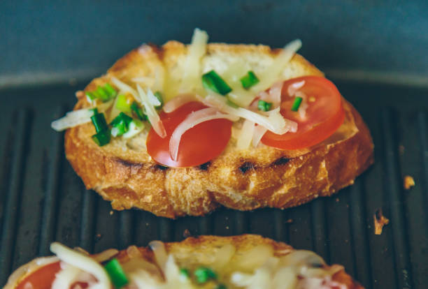 istock bread grilled with cheese, onions and tomatoes 908304734