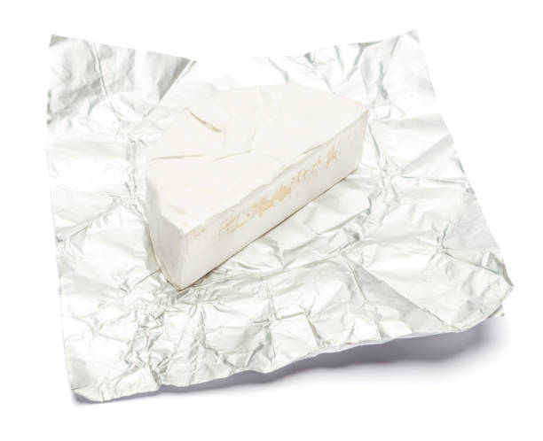 istock Piece of brie or camambert cheese on a white background 908307504