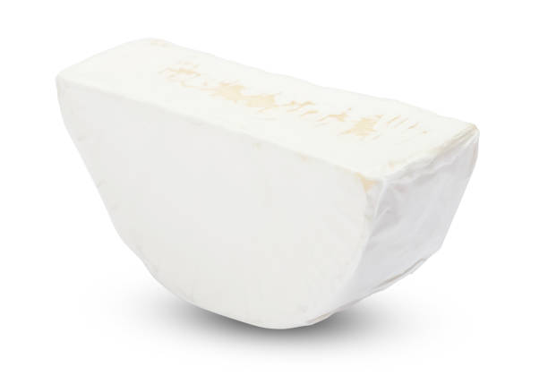 istock Piece of brie or camambert cheese on a white background 908307654