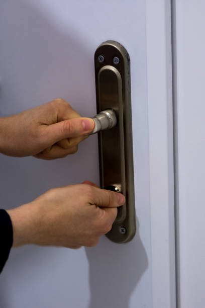 istock Woman locking the door 908307746