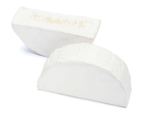 istock Piece of brie or camambert cheese on a white background 908307922