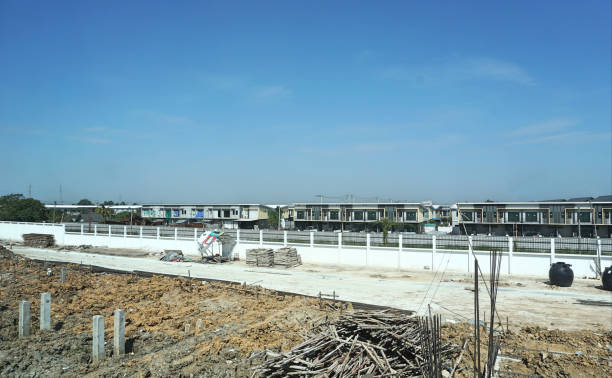 istock Piling work of home base with wood, concrete and equipment construction site background. Building construction concept. 908311250