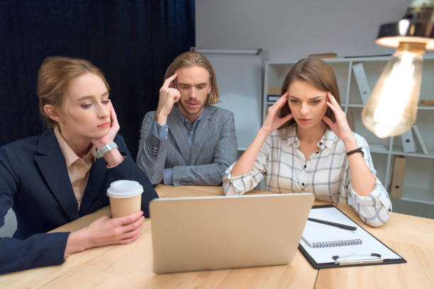 istock business team have discussion while sitting at table with laptop 908314790