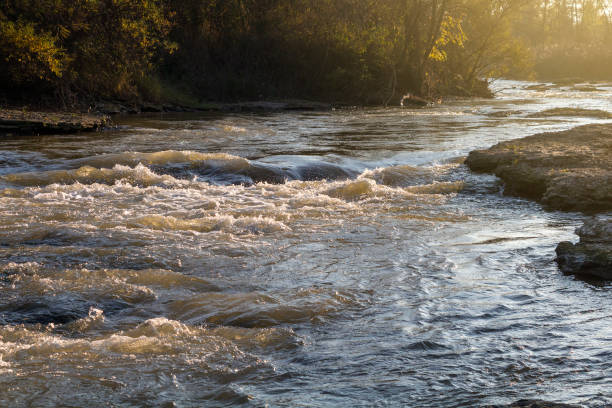 istock View of the water in the fast river at sunset 908317302