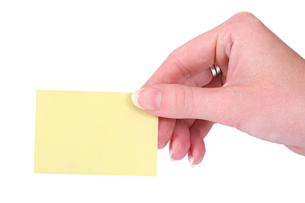 istock Hand holding a yellow blank notecard 90831795