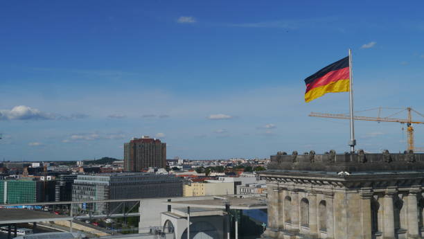istock Flag of Germany flies over Berlin 908320616