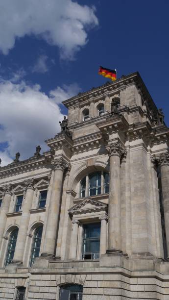 istock German Flag at the Reichstag, Berlin 908320620