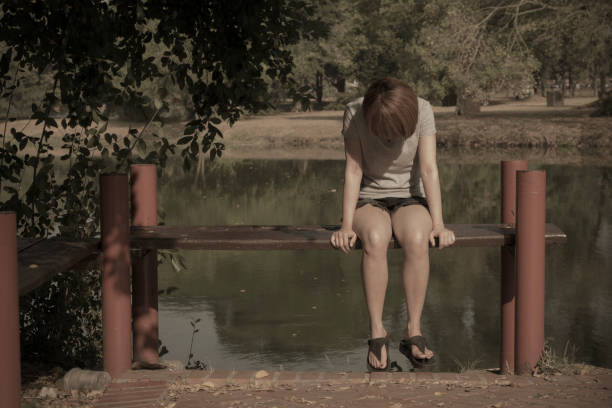 Young woman sitting alone