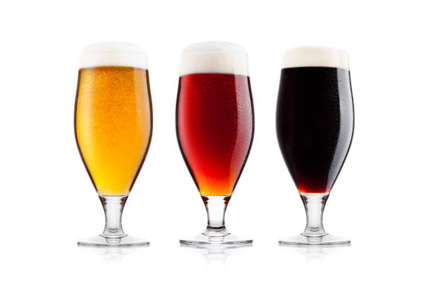 istock Cold glasses of lager stout and red beer with dew 908320896