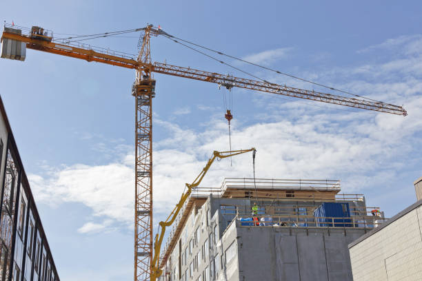 istock construction crane, construction of a new building 908320934