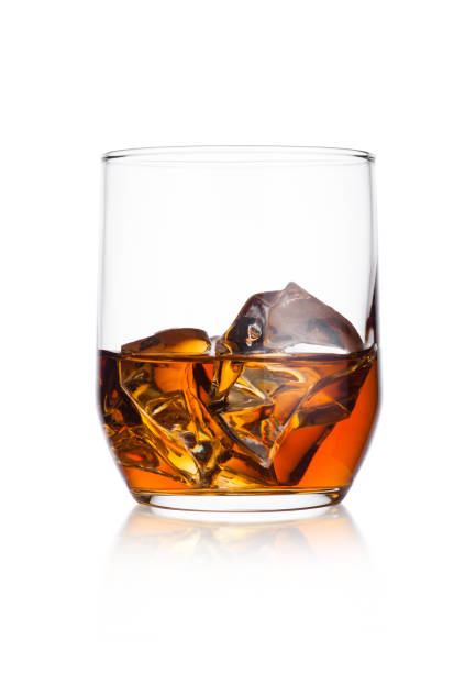 istock Elegant glass of whiskey with ice cubes 908321072