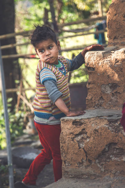 istock Poor Little Boy Standing Portrait 908333436