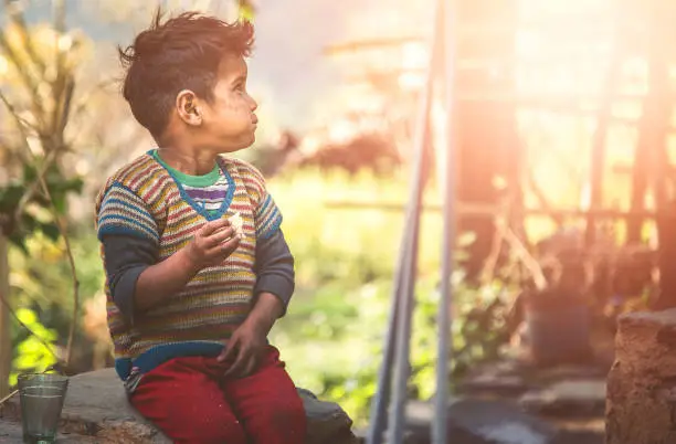 Photo of Little Hungry boy in Poverty.