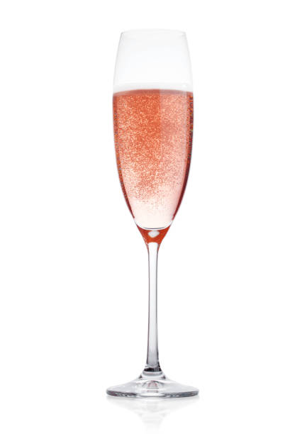 istock Rose pink champagne glass with bubbles isolated 908333756